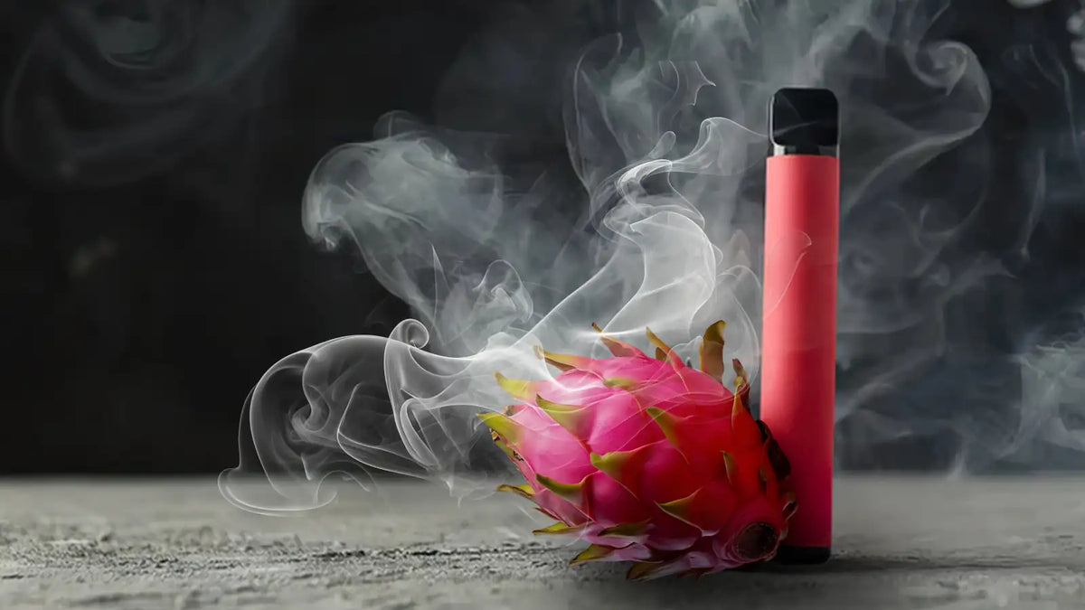 Un puff rose avec un fruit du dragon et de la fumée qui se dégage